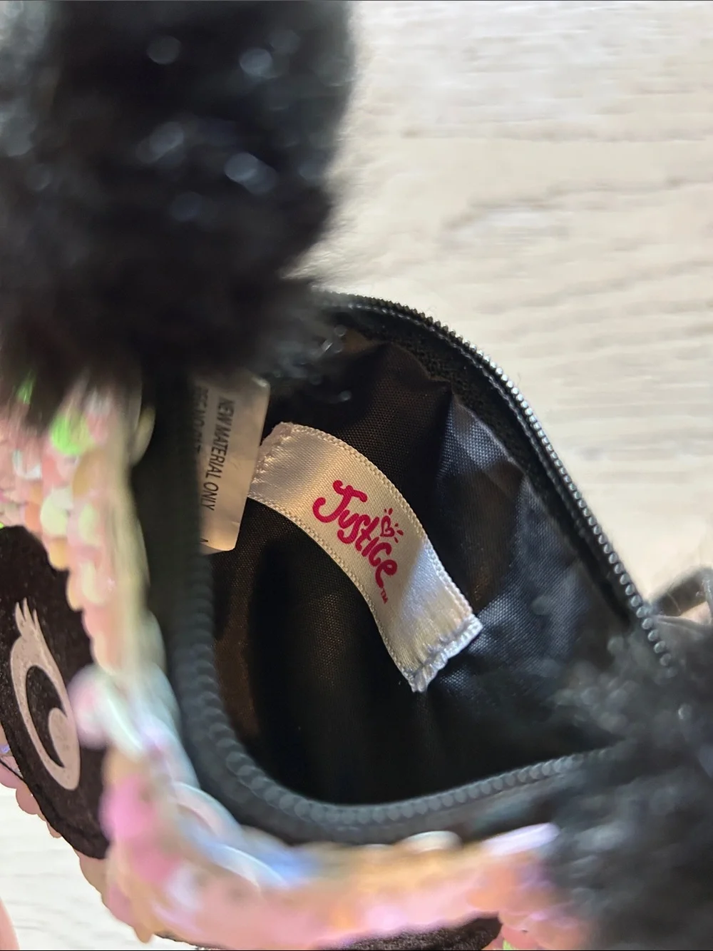 Justice Iridescent Sequin Panda Wristlet with Black Pom Poms